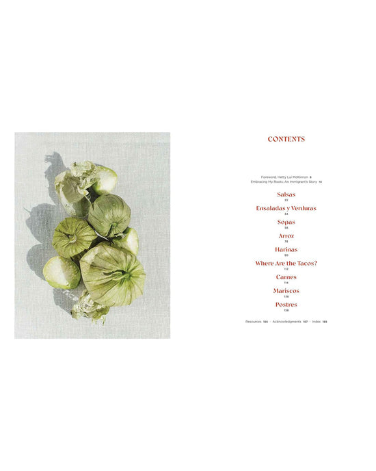 Six green tomatillos rest on a textured surface beside a table of contents listing Salsas, Arroz, and Postres—offering a peek into Mamacita by Chronicle Books, a Mexican cookbook celebrating cherished family recipes.