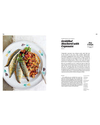 Three grilled mackerel fillets with caponata rest on a light surface. The recipe text for Griddled Mackerel with Caponata from Recipes from Sicily by Chronicle Books appears on the right, inspired by traditional Sicilian flavors.