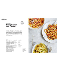 An overhead view from Recipes from Sicily by Chronicle Books shows an Aubergine Pesto recipe on the left and three pasta plates with various sauces on the right—ideal inspiration for lovers of Sicilian cuisine.