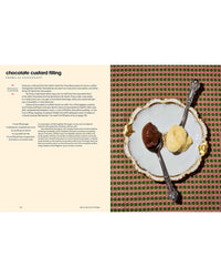 A decorative plate with chocolate and vanilla custard from *Sicily, My Sweet* by Chronicle Books sits on a red-green netted tablecloth, with a recipe excerpt from the cookbook shown on the left.