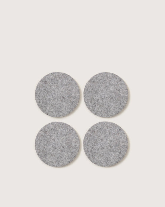 Four round Granite Bierfilzl Merino Wool Felt Coasters by graf lantz, arranged in a square on a light background. Crafted from premium German Merino wool. Pack of 4.