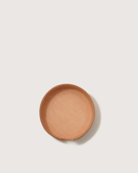 The graf lantz Kobon Leather Round Tray in Natural, shaped round and shallow like a sustainable leather dish, sits centered on a plain white background—an elegant, versatile organizer for any space.
