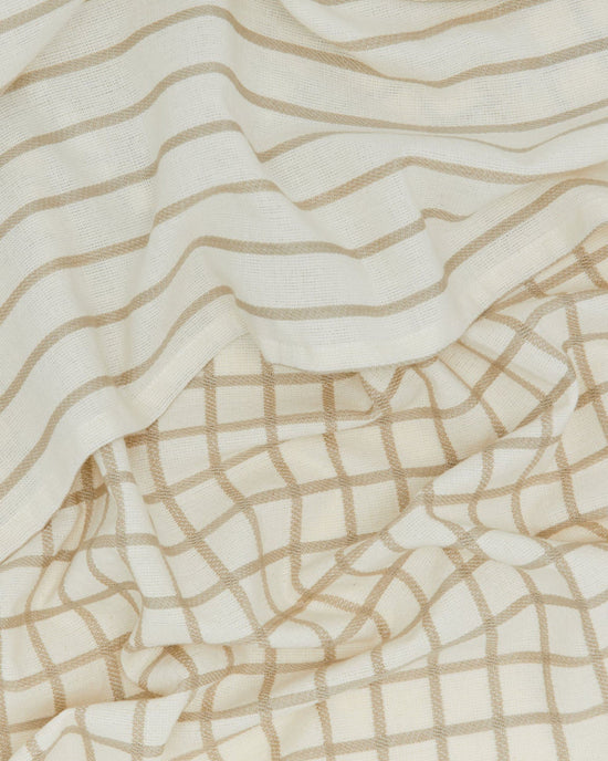 A close-up of cream-colored Oeko-Tex cotton with beige stripes and a grid, both gently wrinkled—perfect for the Hawkins New York Essential Dish Towels in Flax/Ivory (Set of 2).