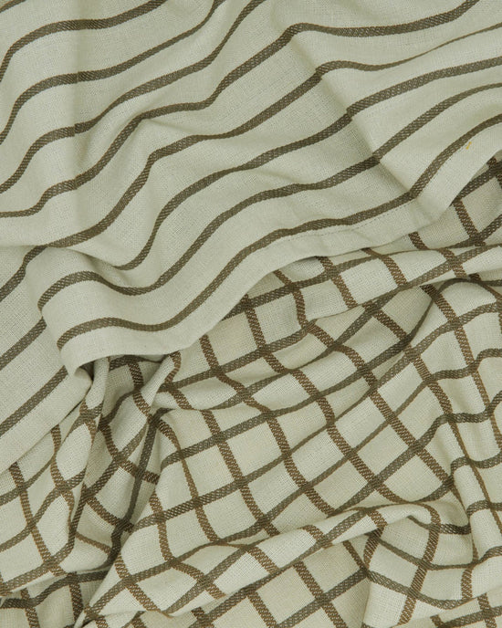 The Essential Dish Towels in Olive/Sage by Hawkins New York, sold as a set of 2, feature subtle stripes and grid patterns—draped in a classic style for absorbent, stylish kitchen use.