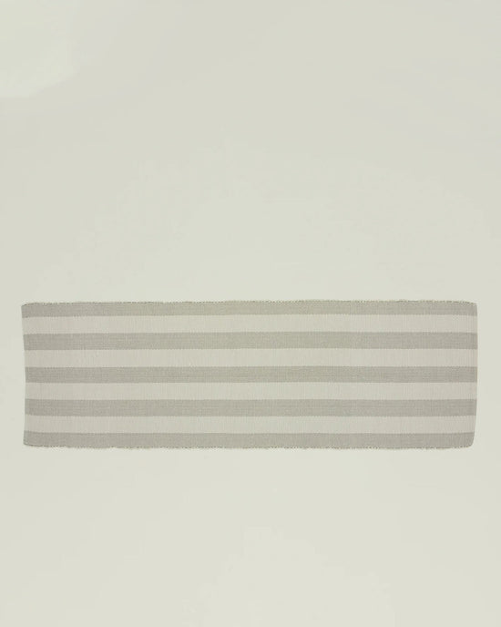 The Hawkins New York Essential Floor Runner in Light Grey is a rectangular, recycled-fiber hallway rug with horizontal gray and white stripes, shown against a plain white background.