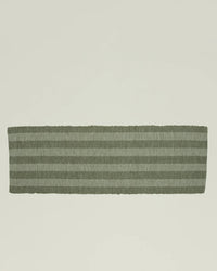 The Hawkins New York Essential Floor Runner in Olive, a rectangular hand-loomed rug with horizontal light and dark green stripes made from recycled fibers, is displayed on a plain light background.