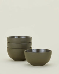 Set of 4 Essential Large Bowls in Olive by Hawkins New York, shown with three stacked and one beside on an off-white background. These stoneware bowls are dishwasher safe and perfect for everyday use.
