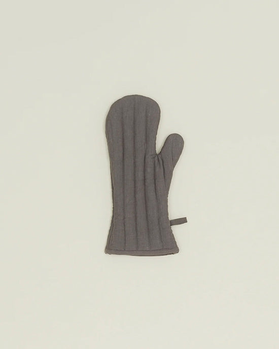The Hawkins New York Simple Linen Oven Mitt in Dark Grey is shown on a plain light background, featuring quilted linen, heat-resistant padding, a thumb section, and a small hanging loop.