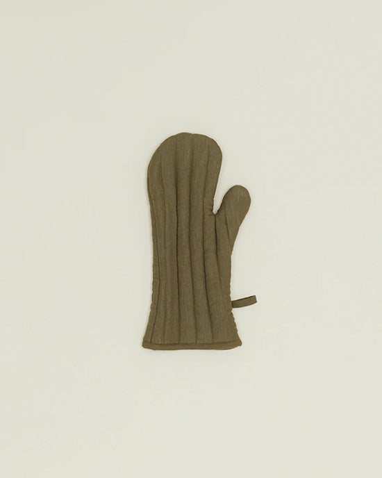 The Hawkins New York Simple Linen Oven Mitt in Olive, with heat-resistant padding, a thumb section, and a small loop for hanging, is shown lying flat on a plain light background.