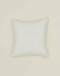 The Simple Linen Pillow - 18 X 18 Inches in Ivory by Hawkins New York, featuring a down insert, is centered against a light beige background.