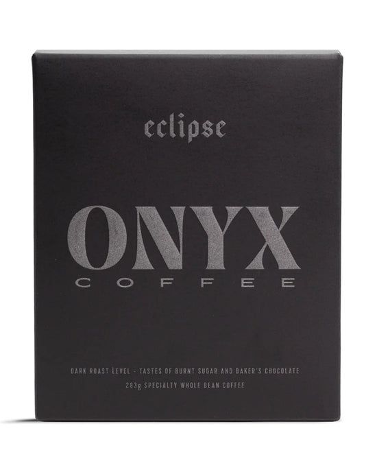 A black bag of Onyx Coffee Lab’s Eclipse Coffee, labeled as a dark roast with tasting notes and 10oz of specialty whole bean coffee.