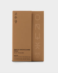 A brown box of Onyx Coffee Lab Gochujang Chai Tea (15 sachets) with Korean characters, featuring Nilgiri black tea and organic chai with notes of ginger, chestnut, red pepper, and malt.