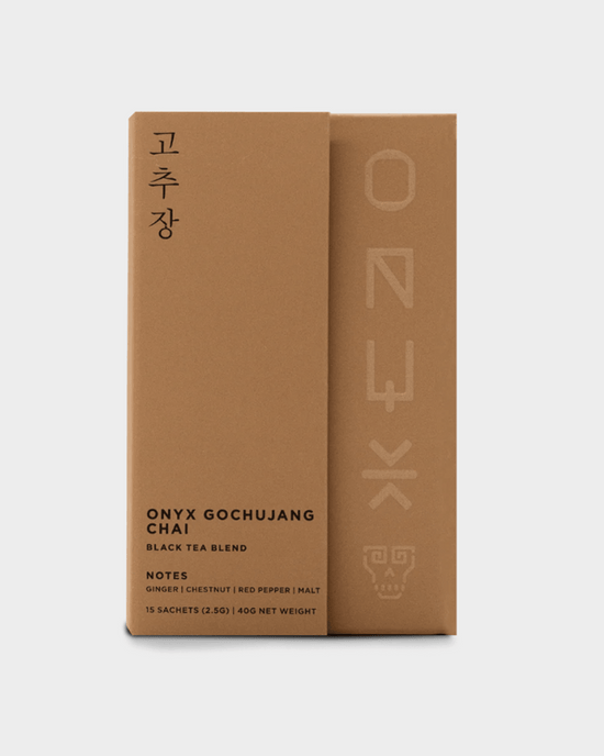 A brown box of Onyx Coffee Lab Gochujang Chai Tea (15 sachets) with Korean characters, featuring Nilgiri black tea and organic chai with notes of ginger, chestnut, red pepper, and malt.