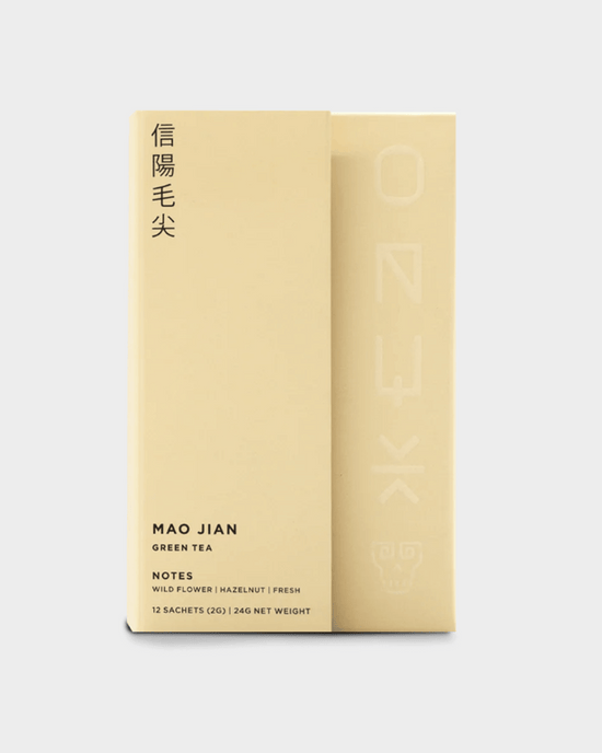 Onyx Coffee Lab Mao Jian Tea | 12 Sachets: Minimalist beige box featuring Chinese and English text; Chinese green tea from Henan with wildflower, hazelnut, and fresh flavor notes.