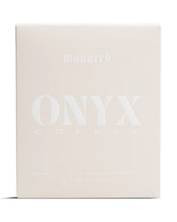 Onyx Coffee Lab’s Monarch Coffee | 10oz comes in sleek, minimalist white packaging with embossed text—ideal for dark roast enthusiasts.