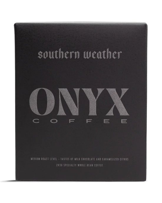 A 10oz black box of Onyx Coffee Lab’s Southern Weather Coffee features silver text with details on its medium roast and specialty flavor notes.