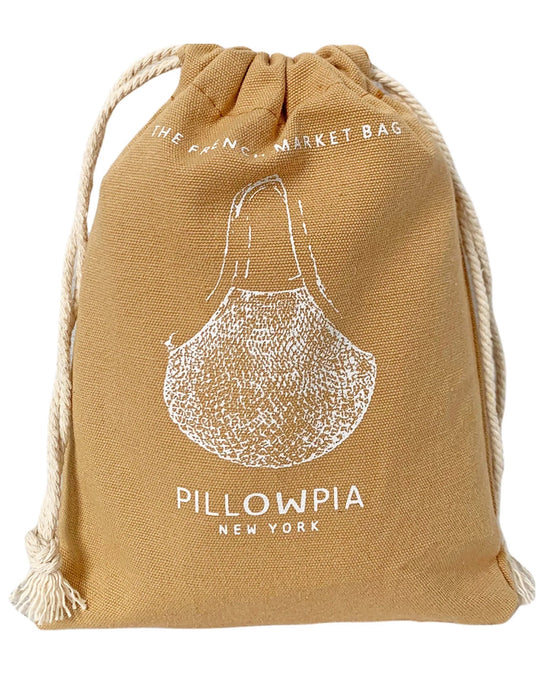 A tan organic cotton bag with white rope, featuring a garlic bulb illustration and the text PILLOWPIA and The French Market Bag No.2 In Wheat.