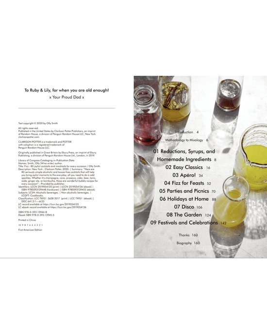 A flat lay of assorted glass jars and glasses filled with colorful Fizz mixers from Random House on a white surface, next to a table of contents from a book or manual.