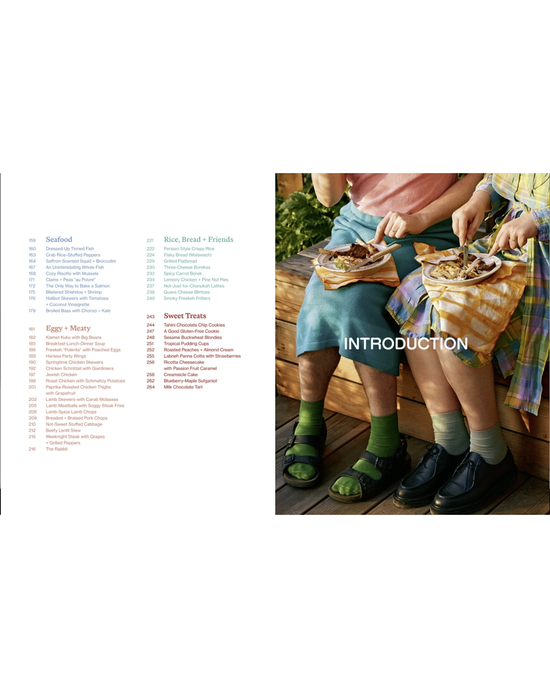 Two people sit side by side eating from plates on their laps, while the table of contents from Kismet by Random House—highlighting Mediterranean flavors—appears on the left of the image.