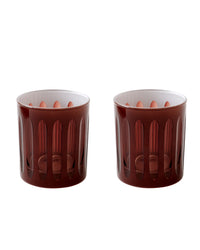 Two transparent dark red SIR / MADAM Empire Rocks Java Set/2 tumblers, each with vertical oval cutout patterns, sit side by side on a white background, showcasing their classic mid-century modern style.