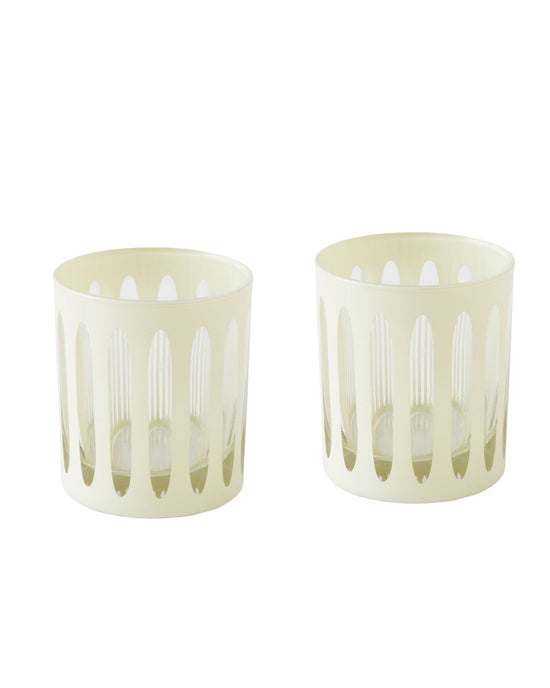 Set of two clear glass cocktail glasses with cylindrical cream holders featuring vertical oval cutouts—stylish midcentury accessories from SIR / MADAM’s Empire Rocks Powder Set/2 collection.
