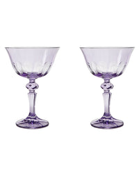 Two Rialto Glass Coupe Amethyst glasses by SIR / MADAM, each with faceted stems, are displayed side by side on a white background.