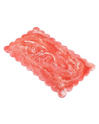 The Casa Amarosa 14in Scallop Resin Rectangular Cheese Board in Pink features a glossy, translucent finish and wavy, scalloped edges, resembling candy. Perfect for serving, it's shown isolated on a white background.