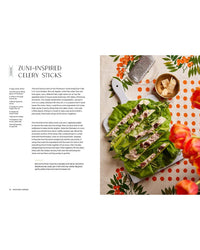 A plate of celery topped with creamy dressing and chives sits beside grated cheese—an ideal scene from Snacking Dinners by Chronicle Books, perfect for your next self-care meal or cookbook inspiration.