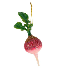 The Cody Foster Farm Field Radish is a glittery glass ornament shaped like a radish, complete with green leaves and a gold hanging string for festive sparkle.