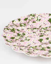 The Meri Meri X Liberty Mixed Set Reusable Large Plates by Meri Meri feature scalloped edges and a pink background adorned with white flowers and green leaves, evoking the charm of classic Liberty print tableware.