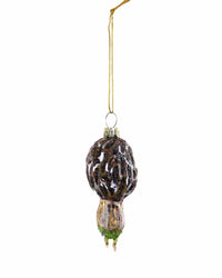 The Cody Foster Morel Mushroom - Short Ornament is a hand-crafted, glittering glass decoration shaped like a morel and hung by a gold string.