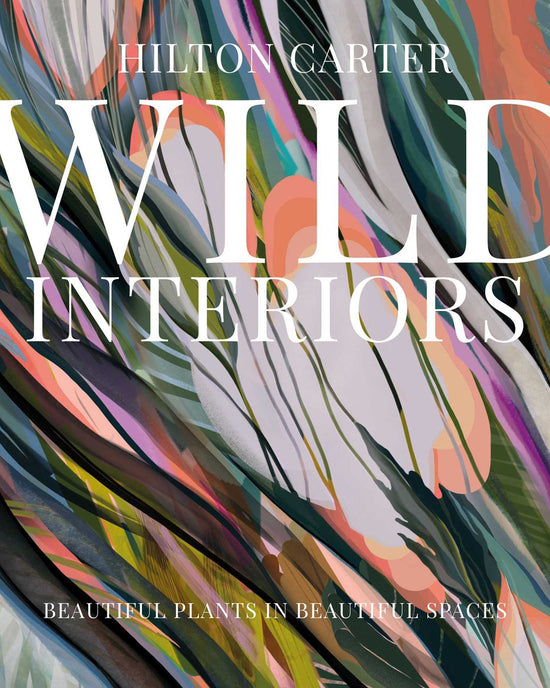 Book cover for Wild Interiors by Simon & Schuster, featuring abstract plant-themed art and the subtitle Beautiful Plants in Beautiful Spaces—ideal for inspiration on decorating with plants and creating stylish interiors.